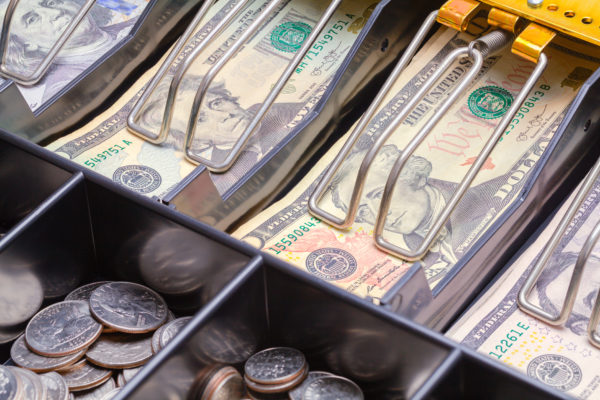 Open Cash Register Drawer Close up with Money.